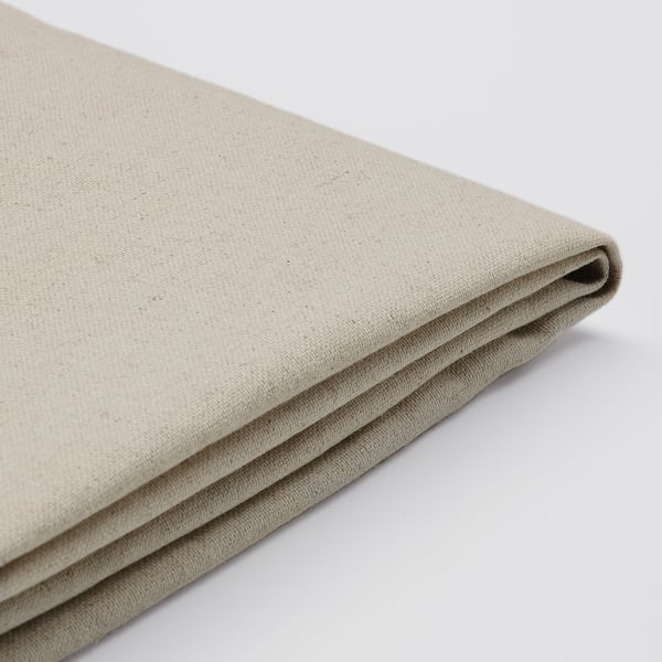 Folded beige fabric, smooth texture, natural linen-cotton blend. Quality home decor item.