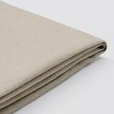 Folded beige fabric, smooth texture, natural linen-cotton blend. Quality home decor item.