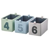 Three fabric boxes, light green, light blue, and grey with large numbers 4, 5, and 6 respectively, upright, rectangular, fabric handles on top.