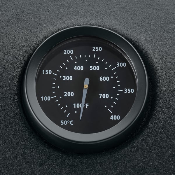Built-in thermometer on BÅTSKÄR outdoor kitchen hood for precise grilling temperature monitoring.