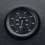 Built-in thermometer on BÅTSKÄR outdoor kitchen hood for precise grilling temperature monitoring.