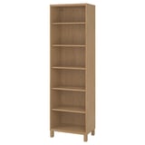 An upright BESTÅ light brown bookshelf with five shelves, crafted from wood.
