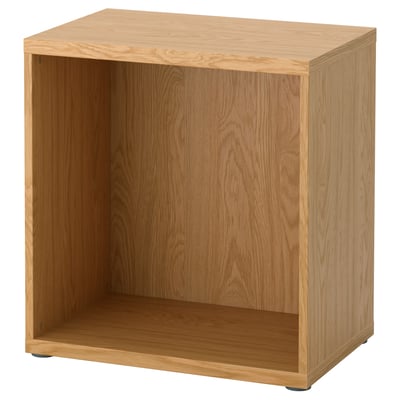 An ikea BESTÅ light brown wooden storage unit. Square shape, open front, sturdy design.