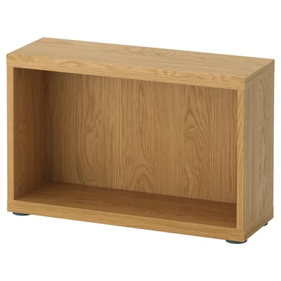 An IKEA BESTÅ wooden storage unit in light oak color, featuring an open shelf design.