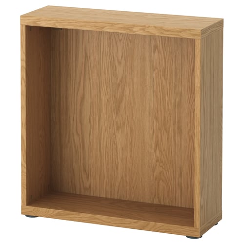A light brown BESTÅ wooden storage unit, rectangular with open shelves for storage.