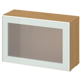 Modern BESTÅ storage unit: white frame, frosted glass door, light wood top & sides.