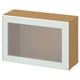 Modern BESTÅ storage unit: white frame, frosted glass door, light wood top & sides.
