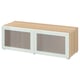 A light wood-colored BESTÅ tv unit with frosted glass doors and white framing.