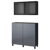 Two pieces of modern furniture: a dark grey cabinet with drawers and glass-fronted wall cabinet.