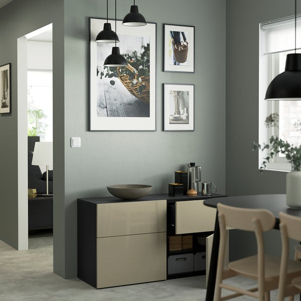 Modern living room with green BESTÅ sideboard, art, and lighting.