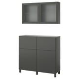 Dark grey ikea BESTÅ storage furniture, including a cabinet and wall-mounted glass-door units.