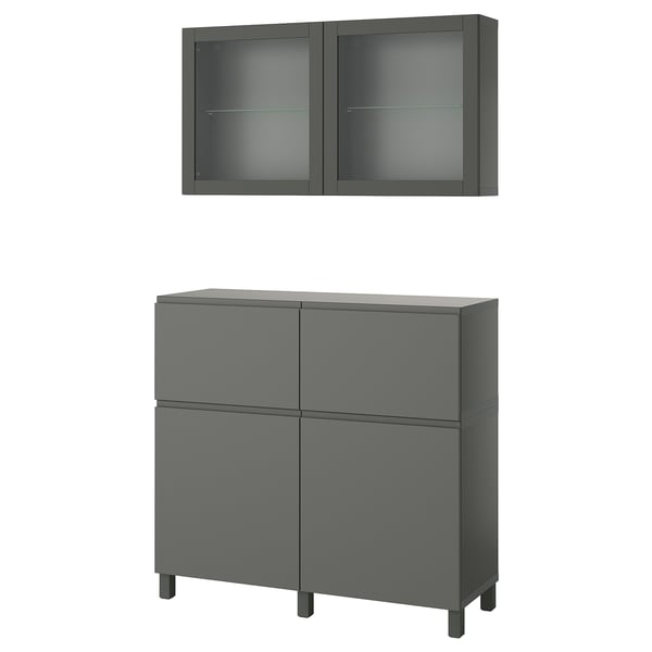 A dark grey BESTÅ furniture set with a storage cabinet and wall-mounted glass doors.