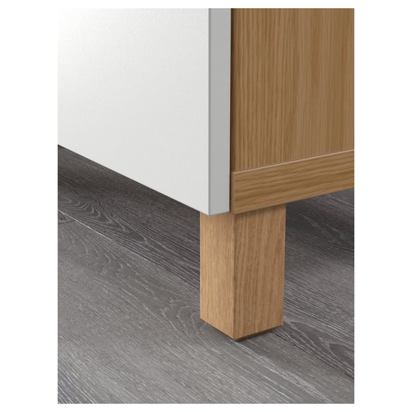 Modern wooden cabinet with light airy legs, elevating style and ease of cleaning.