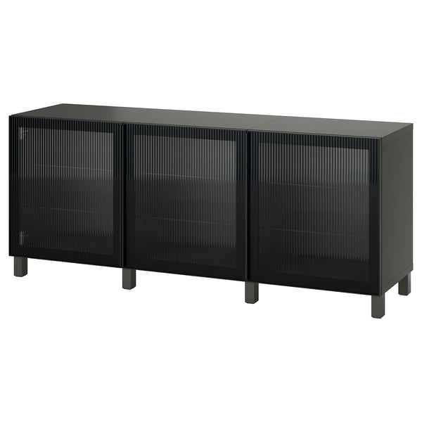 Black BESTÅ sideboard with three glass doors, slim legs, and textured doors.