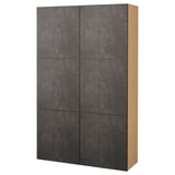 An ikea BESTÅ storage unit with dark gray textured doors and a light wooden frame. It has a rectangular shape with four large compartments.