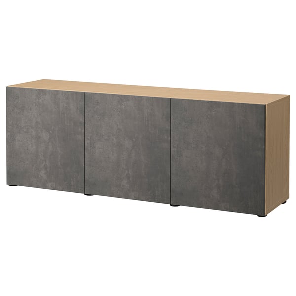 The BESTÅ sideboard a light-colored wooden top and dark gray textured drawers with adjustable shelves, offering both storage and display space.