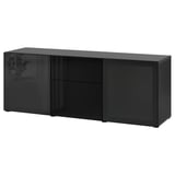 Black BESTÅ sideboard with glass doors, modern design.