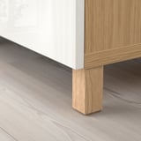 Modern wooden furniture with adjustable shelves and solid oak legs.