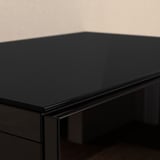 Top panel of sleek, black tempered glass in great condition, showcasing reflective finish.
