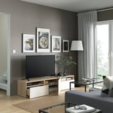 Modern BESTÅ tv bench with drawers, sleek soft-close design.
