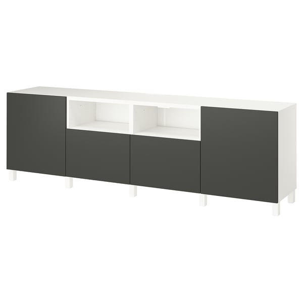 A white and dark grey BESTÅ tv bench with adjustable shelves and drawers for storage.