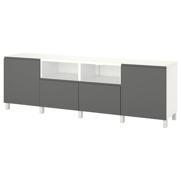 White & grey ikea BESTÅ tv bench with storage compartments.