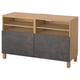 BESTÅ oak tv bench with 3 open shelves and 2 gray doors, modern and sleek.
