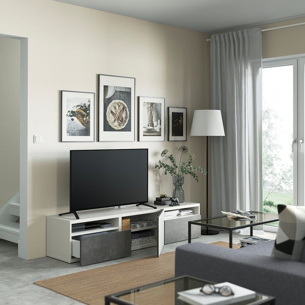 Modern living room with BESTÅ tv bench, soft-close drawers, and flat-screen tv.