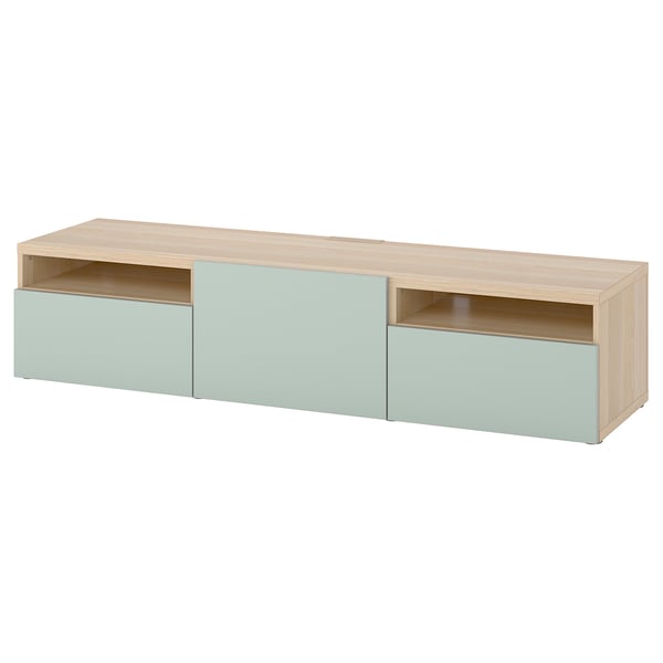 An ikea BESTÅ tv bench in light oak and light blue. It offers storage with drawers and cable management.