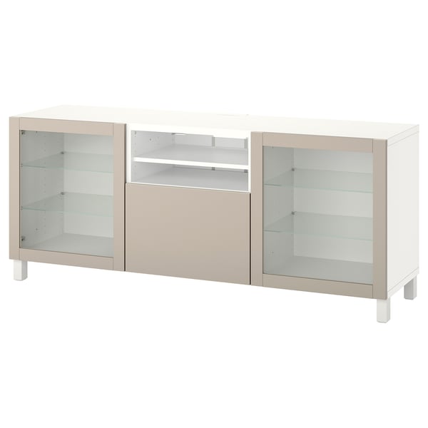 A white BESTÅ tv bench with glass doors and beige accents, featuring adjustable shelves and cable management.
