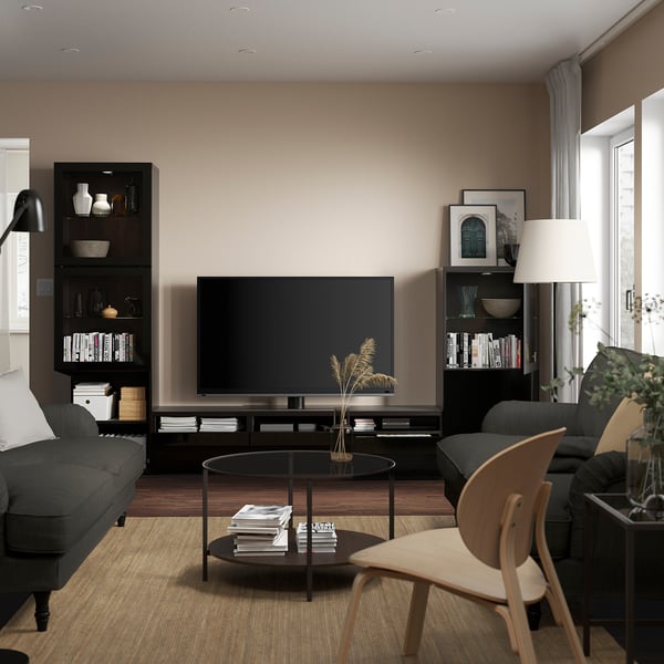 Modern living room with BESTÅ tv storage, organized media & books.