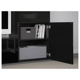Black BESTÅ cabinet with adjustable shelves, soft-closing doors, and cable management at back.
