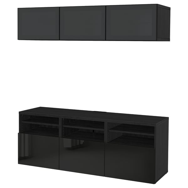 Black BESTÅ tv storage unit with wall-mounted cabinets and open shelves, sleek and modern design for efficient storage and cable management.