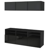 Black BESTÅ tv storage unit with wall-mounted cabinets and open shelves, sleek and modern design for efficient storage and cable management.