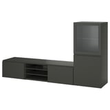 Displays a black BESTÅ tv unit with a glass cabinet and shelves, combining modern design and functional storage.