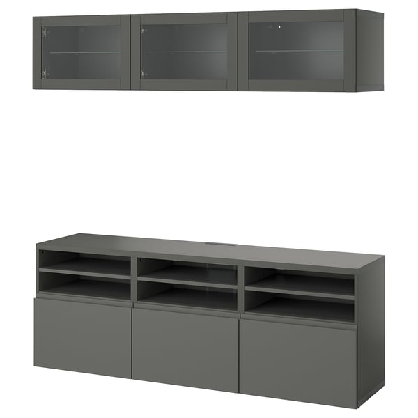 Dark gray BESTÅ tv unit & wall cabinets; modern, sleek design with glass and metal accents.