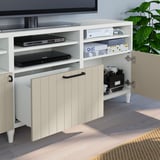 White BESTÅ tv stand with adjustable shelves, cable management, and soft-closing drawers.
