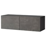 Black rectangular BESTÅ storage unit with two large doors, sleek modern design.