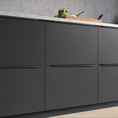 Modern kitchen cabinets with sleek, minimalist handles in dark grey, perfect for contemporary design.