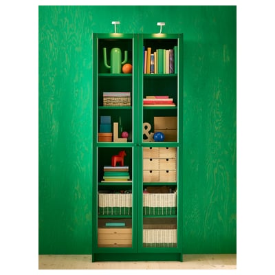 Green BILLY bookcase with glass doors, modern design.