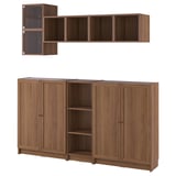 Wooden wall shelving unit and bookcases. Dark brown finish. Four doors, open center with shelves, and wall-mounted shelves.