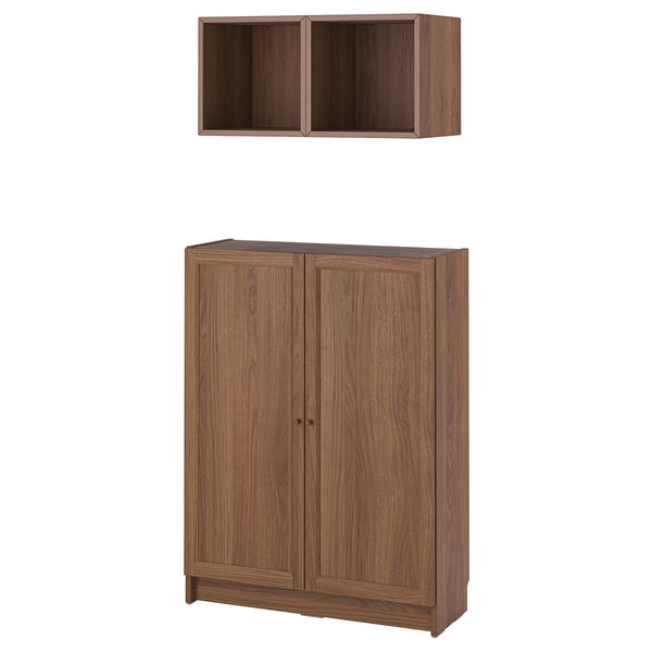 Wooden BILLY bookcase and wall shelf in brown. Two-door cabinet and open cube design for storage.