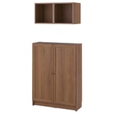 Wooden BILLY bookcase and wall shelf in brown. Two-door cabinet and open cube design for storage.