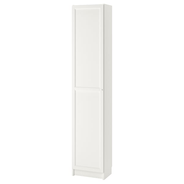 A white BILLY bookcase, sleek and narrow, with an enclosed panel door and adjustable shelves, crafted from particleboard and paper foil.