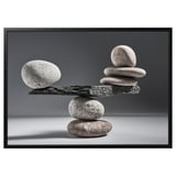Balanced rock formation photo in black & white, minimalist design.