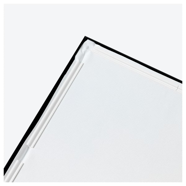 Close-up of modern art canvas with a crisp black frame and clean edge.