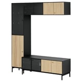 Modern black and light wood storage unit. Tall cabinets, sideboard, and wall shelves. Blends sleek design with practical storage.