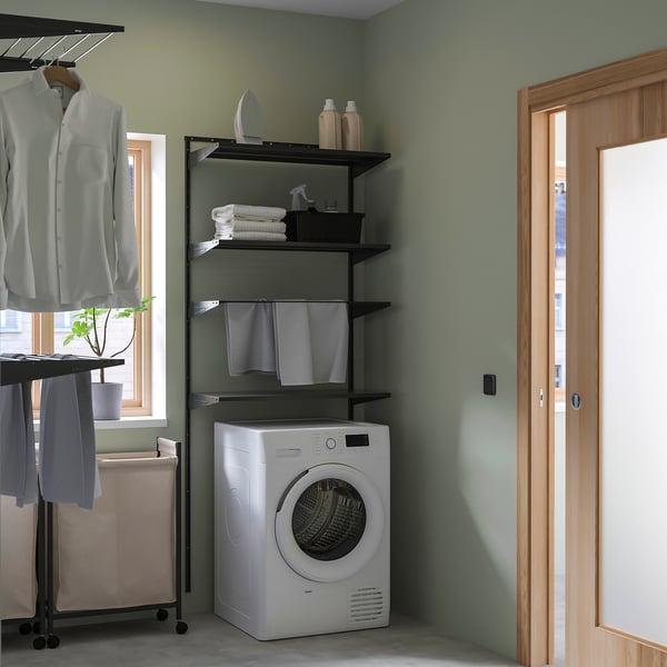 Laundry corner with BOAXEL storage, washer dryer, and drying rack.
