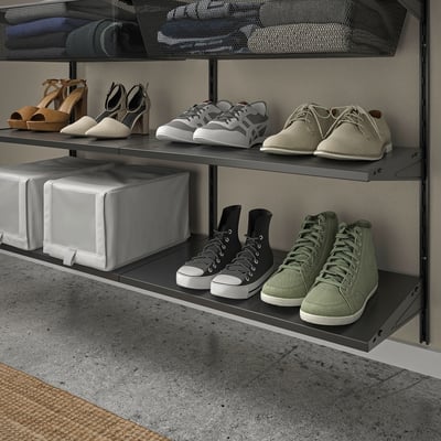 Shoe storage shelves, organizing footwear neatly.