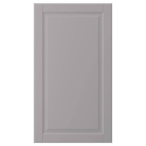 A grey BODBYN cabinet door with a smooth, bevelled panel design in fibreboard.